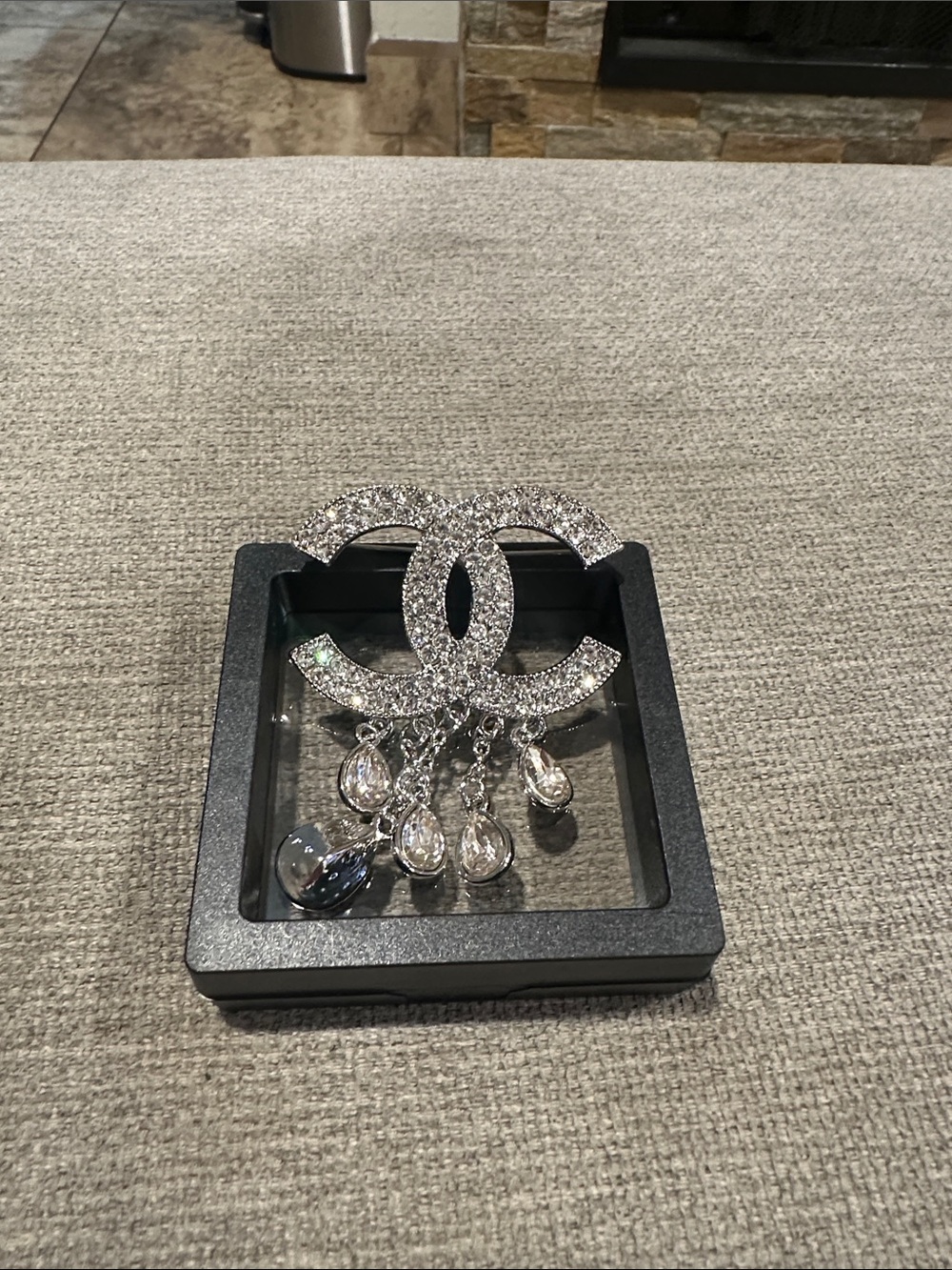 Silver Crystal Interlocking Circle Brooch with Dangling Teardrops